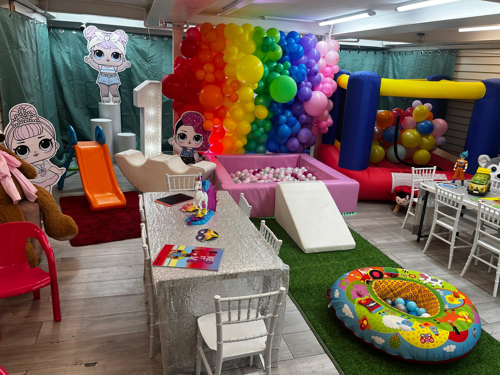 First birthday — rainbow balloon arch, ball pit & soft play