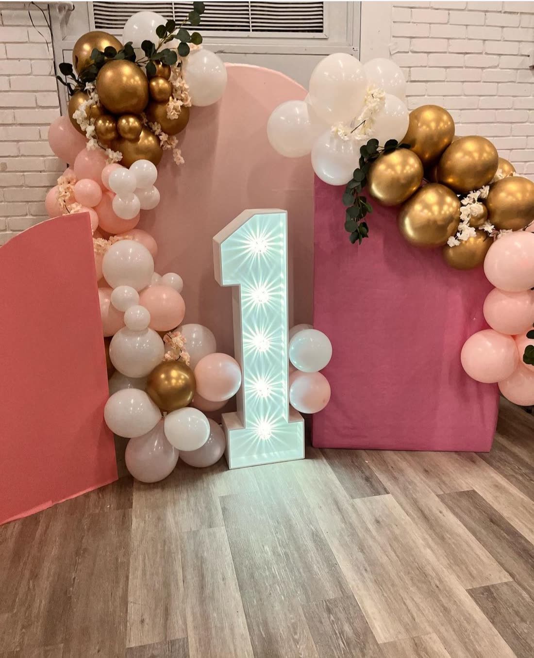 First birthday backdrop — light-up number 1 with pink & gold arch