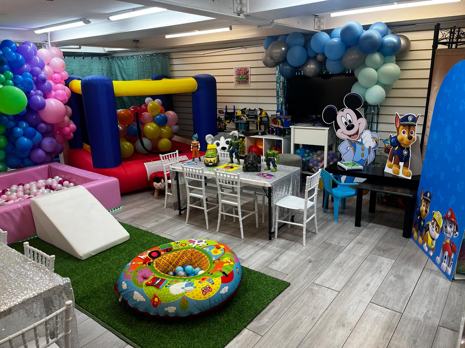 Soft play, ball pit and balloon arches set up indoors